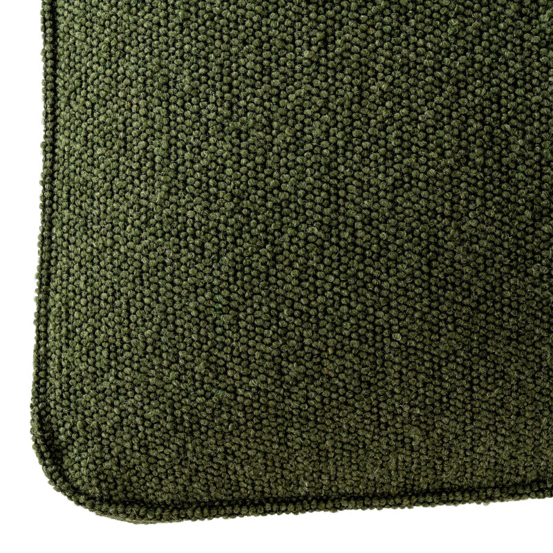 Close-up of a green textured bar stool corner on a white background