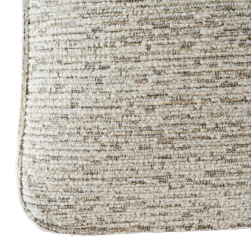 Close-up of a textured beige stool corner