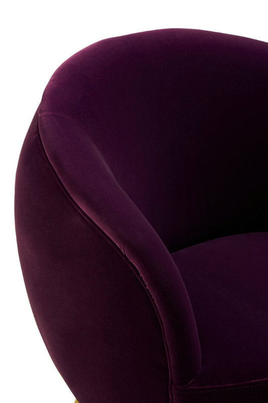 Close-up of a purple velvet chair on a white background
