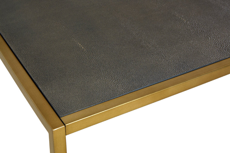 Table with dark leather top and gold metal frame