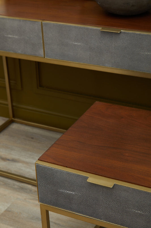 Close-up of a wooden and metal furniture piece with a textured finish.