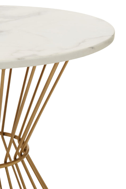 Round marble table with gold metal base on a white background