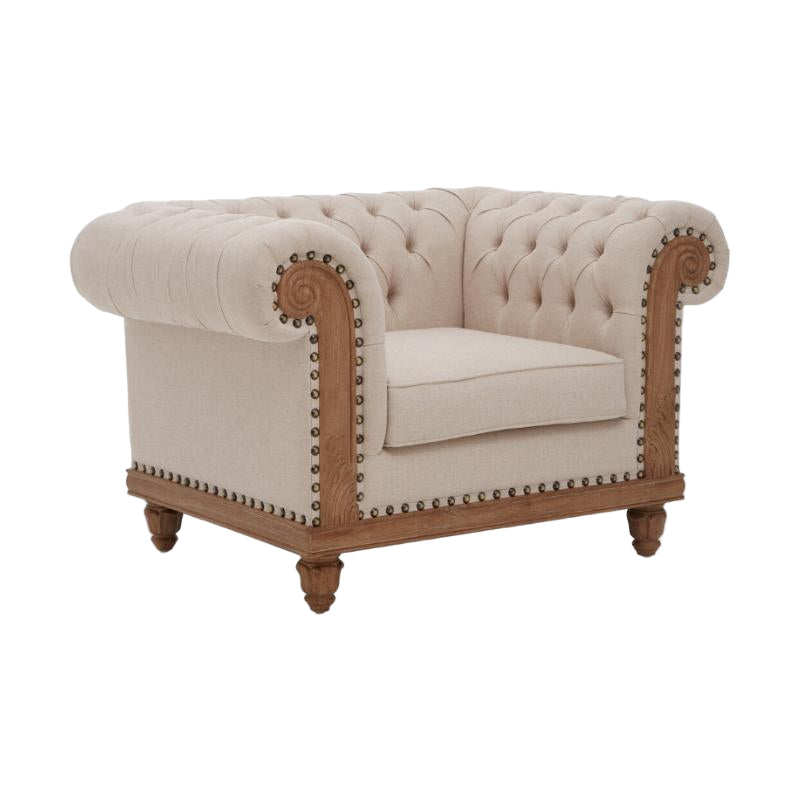Beige armchair with wooden frame and nailhead trim on a white background