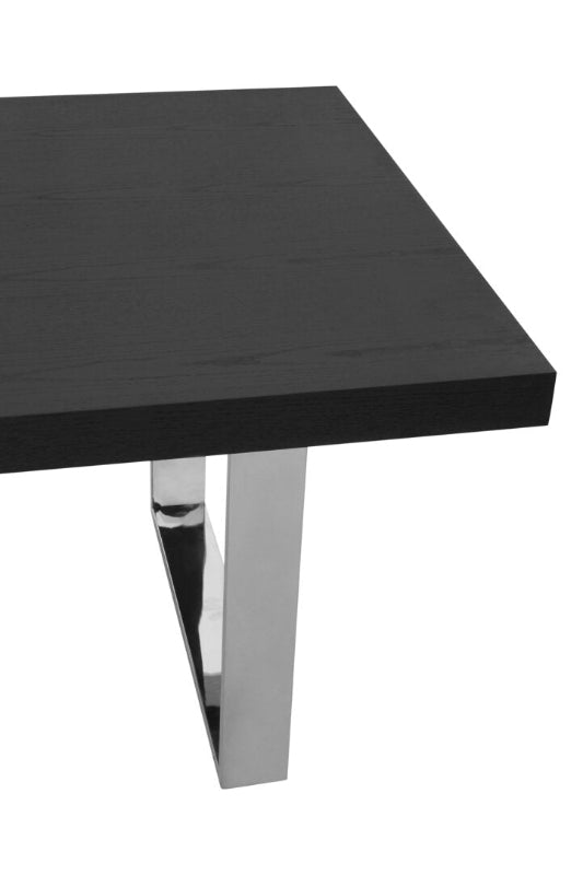 Black rectangular table with chrome legs on a white background