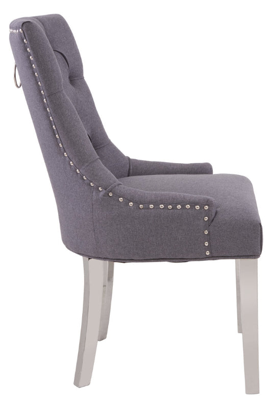 Gray upholstered chair with silver nailhead trim on a white background