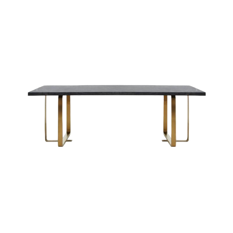 Dining table with a dark surface and gold metal legs on a white background