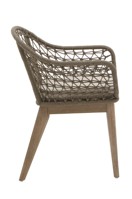 Brown woven chair with wooden legs on a white background