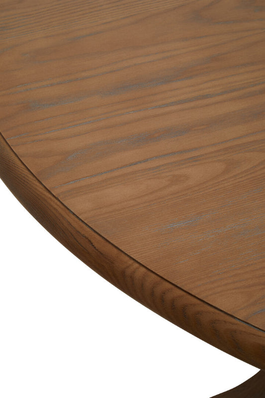 Close-up of a wooden table surface with a focus on texture and grain.