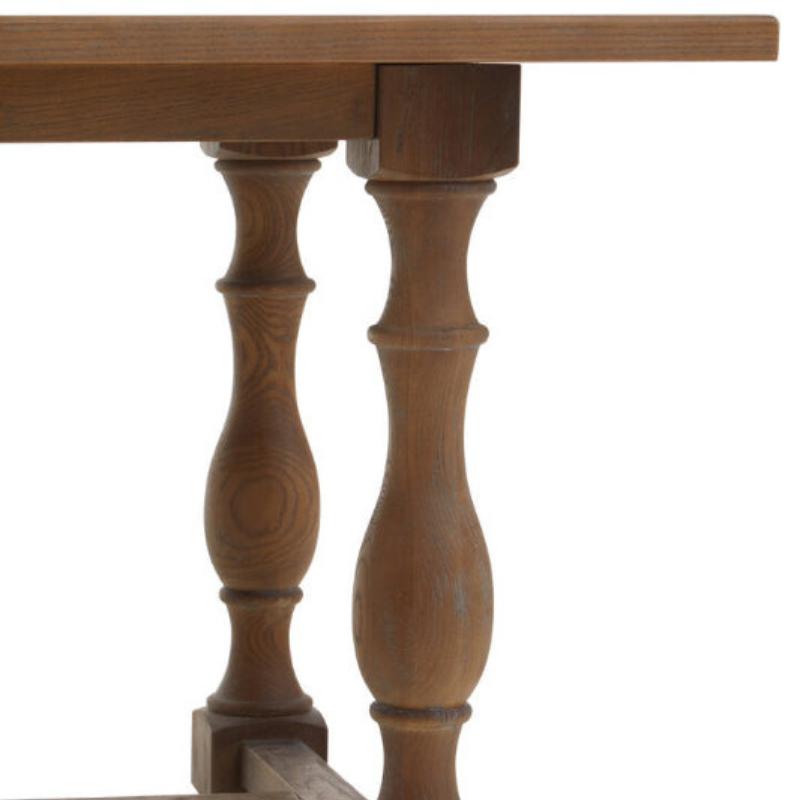Wooden table with turned legs on a white background