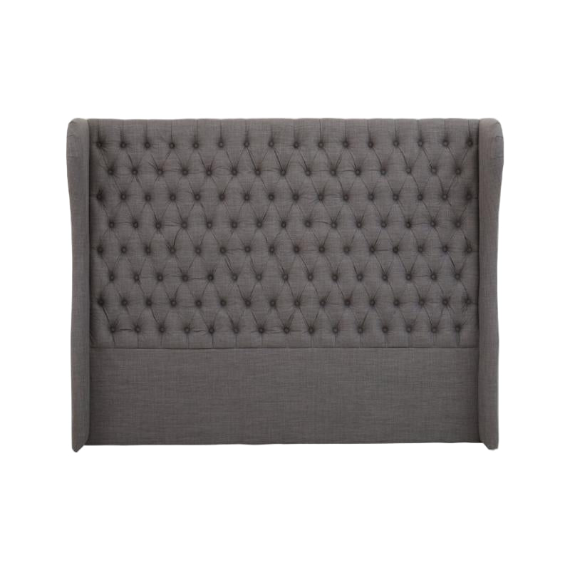 Gray tufted headboard on a white background