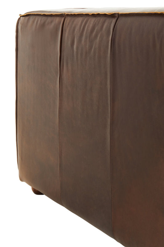 Brown leather sofa side on a white background