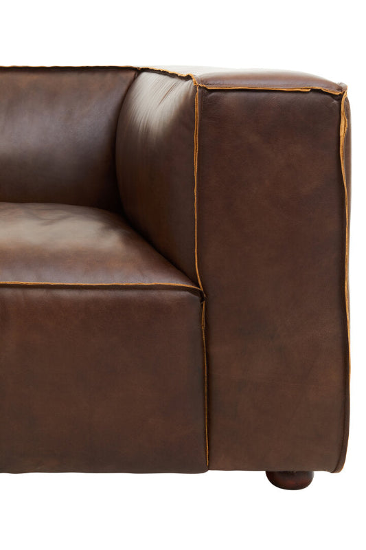 Brown leather sofa corner on a white background