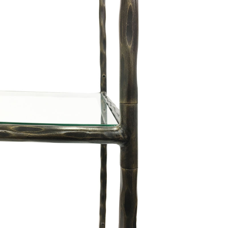 Glass shelf with bronze metal frame on a white background