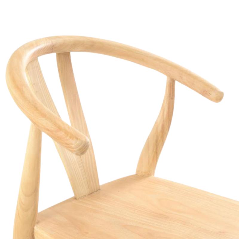Close-up of a light natural wood chair with a curved backrest and seat on a white background.