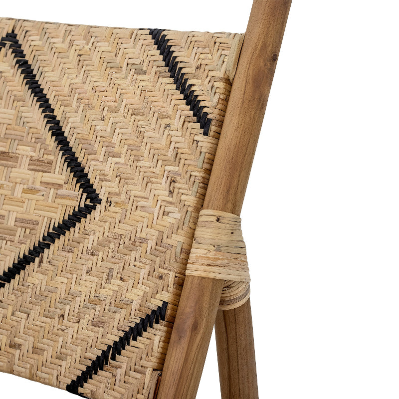 Close-up of a woven chair with wooden armrests on a white background