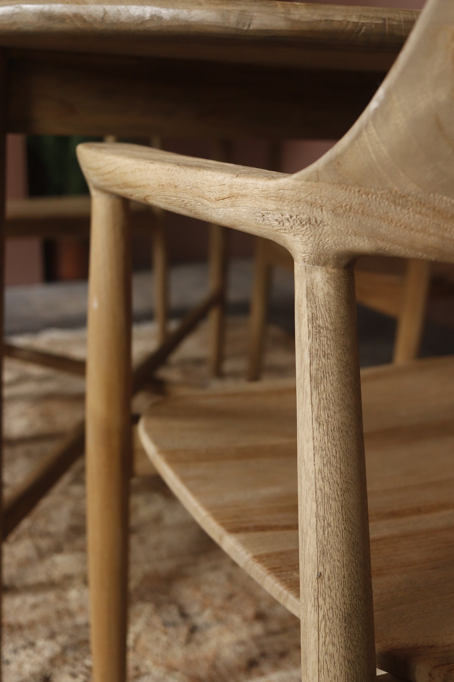 Close-up of a wooden chair with a blurred background
