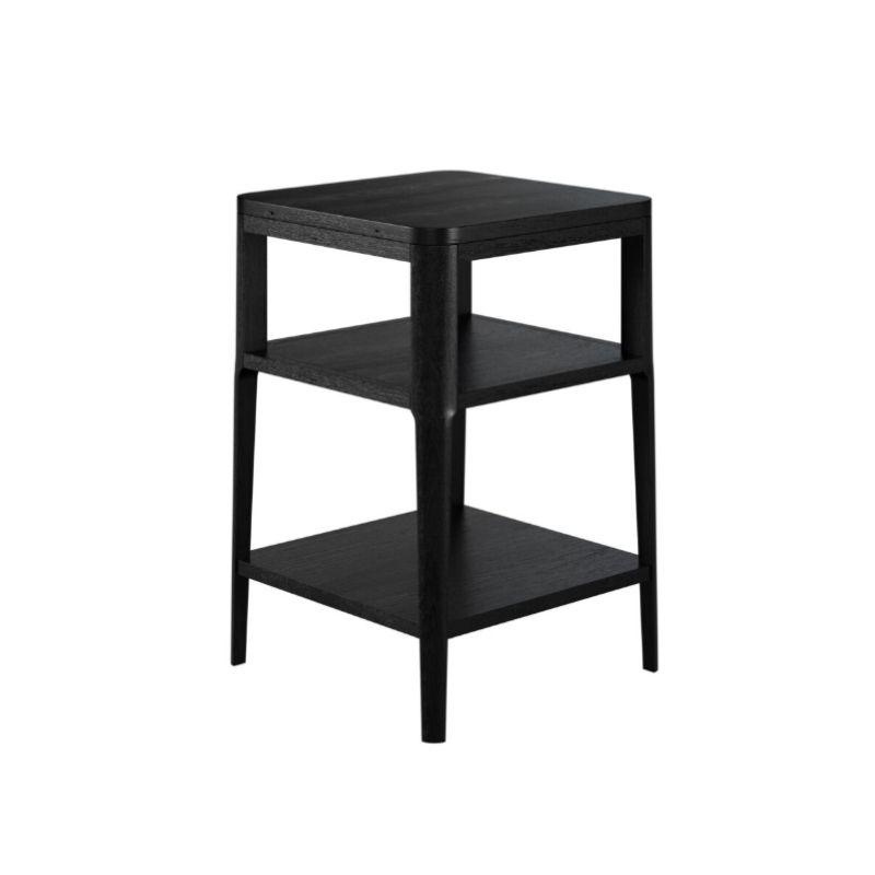 Black three-tiered side table on a white background