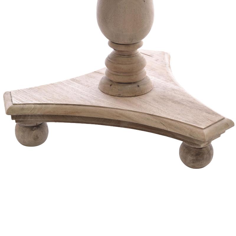 Close-up of a distressed light wood table base with a triangular platform, turned pedestal column, and round feet on a white background.