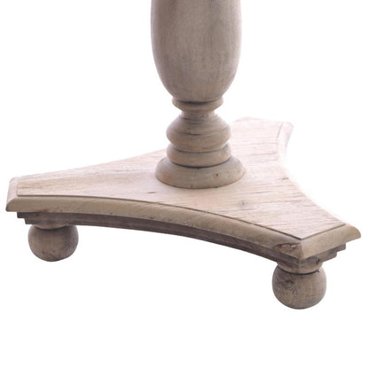Close-up of a distressed light wood table base with a triangular platform, turned legs, and a matching turned pedestal column on a white background.