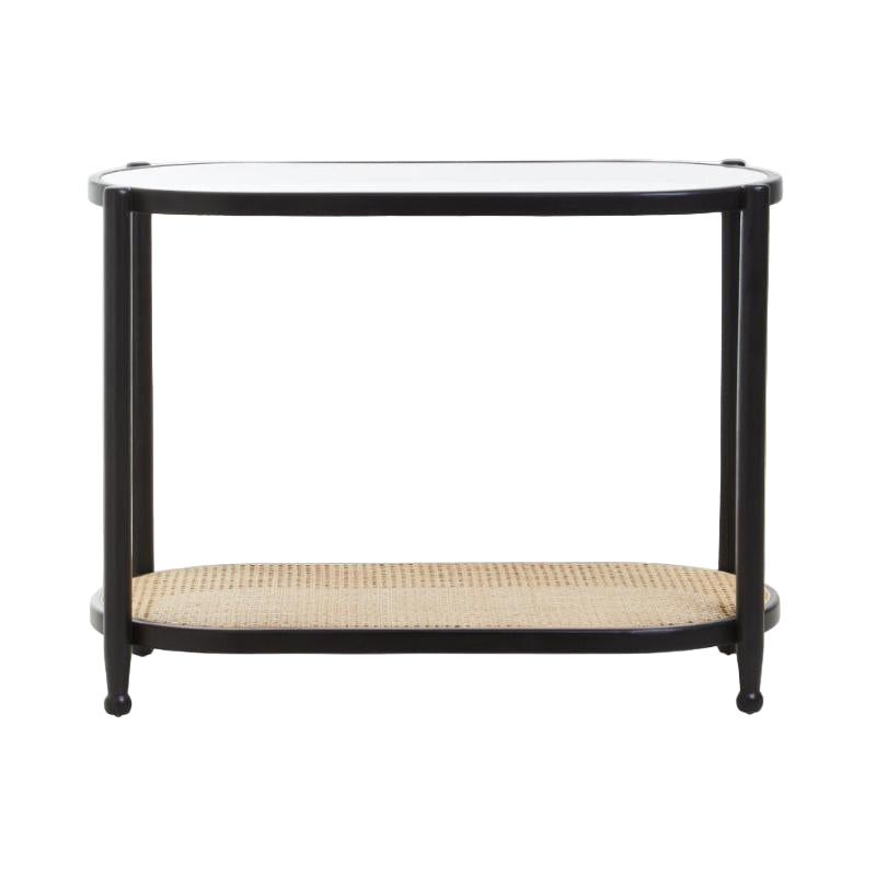 Black metal console table with a glass top and wicker shelf on a white background