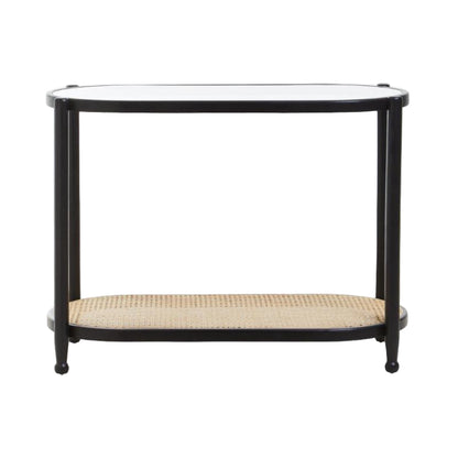 Black metal console table with a glass top and wicker shelf on a white background
