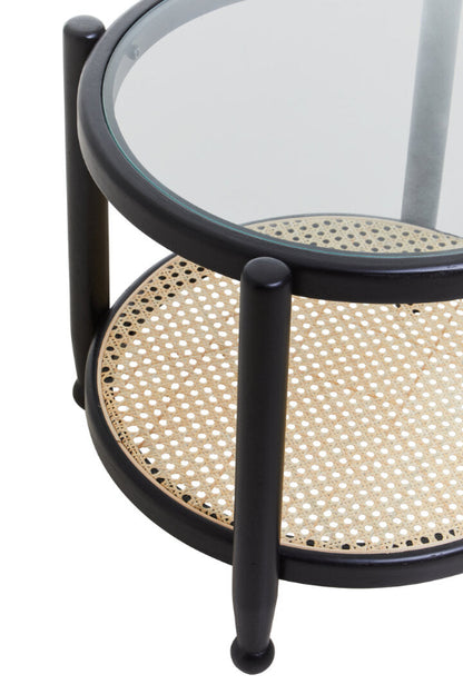 Round side table with glass top and wicker bottom on a white background