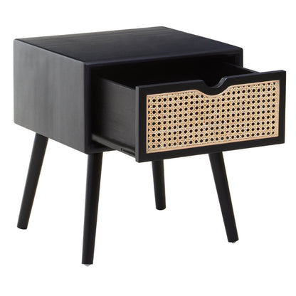 Black side table with a woven drawer on a white background