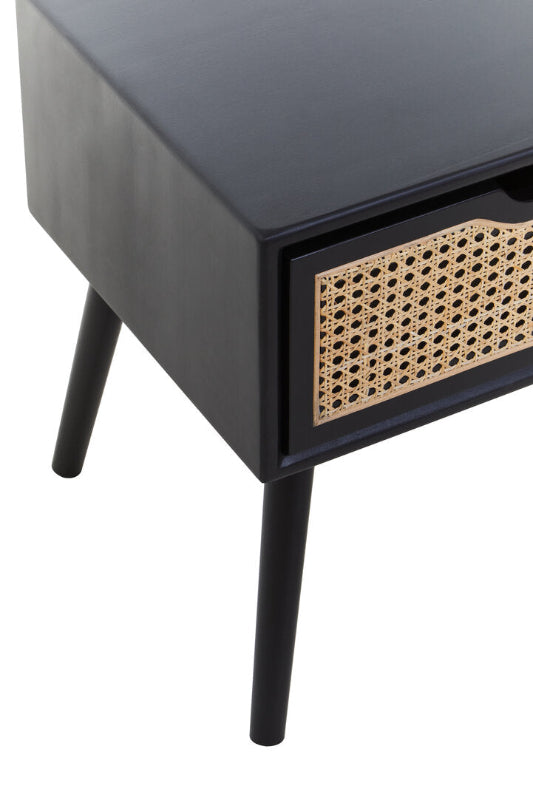 Black cabinet with a woven drawer on a white background
