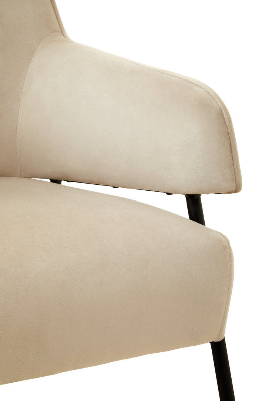 Beige armchair with black legs on a white background