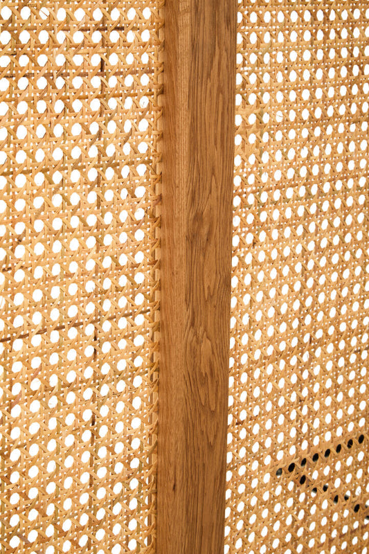 Close-up of woven material with a wooden strip in the center