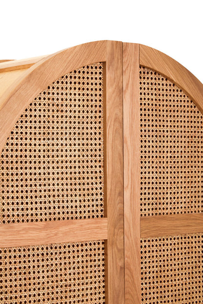 Wooden cabinet with woven cane design on a white background