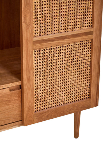 Wooden cabinet with wicker doors on a white background