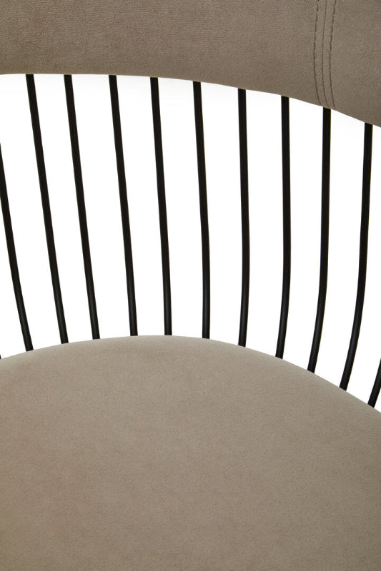 Close-up of a chair with a black slatted backrest and beige seat.