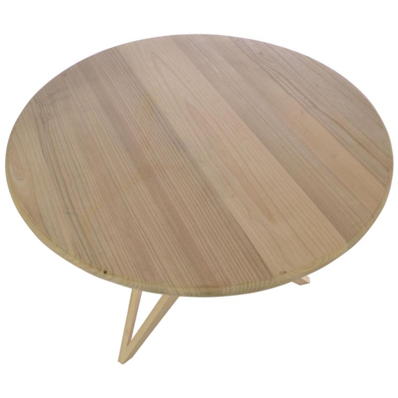 Round wooden table with a minimalist design on a white background