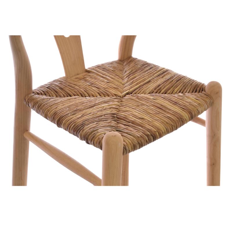 A close-up of a wooden dining chair with a woven rope seat, showing the natural light wood frame and backrest against a white background.