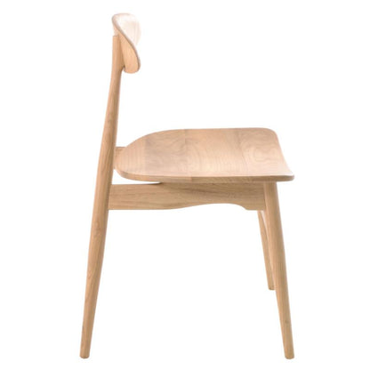 A light natural wood dining chair with a curved backrest, seat, and tapered legs, shown from a side profile view against a plain white background.