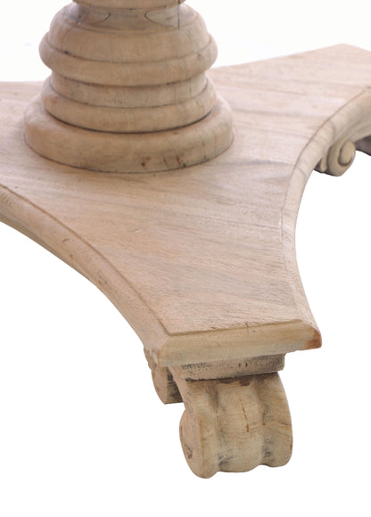 Close-up of a wooden architectural element with intricate carvings on a white background