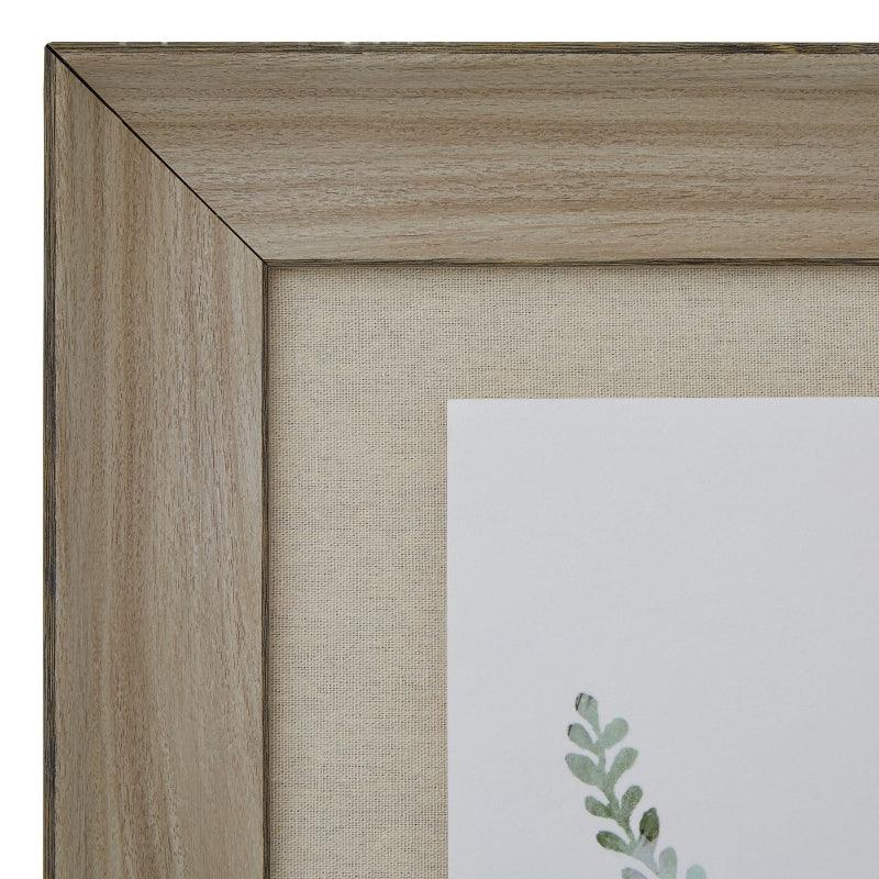 Close-up of a wooden picture frame with a soft focus on a light-colored background