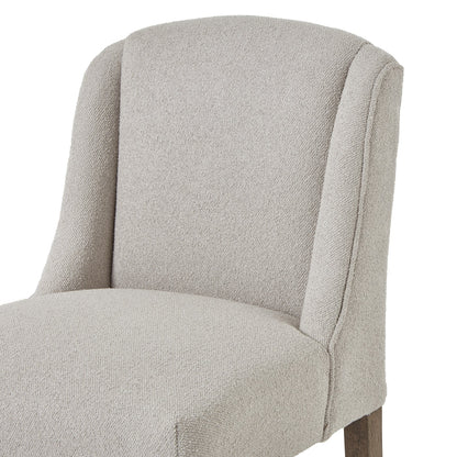 Neutral upholstered chair on a white background