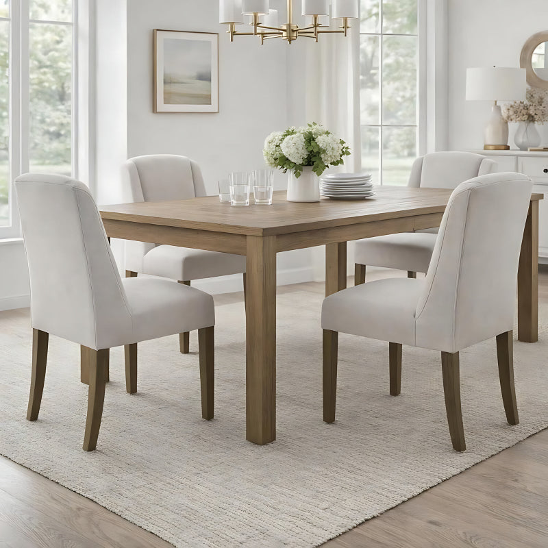 Dining room with wooden table and white chairs in a bright room.