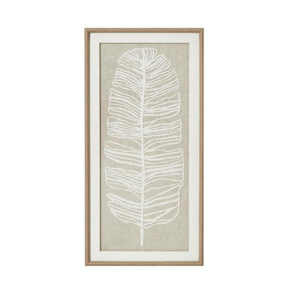 Framed artwork with a white leaf design on a beige background
