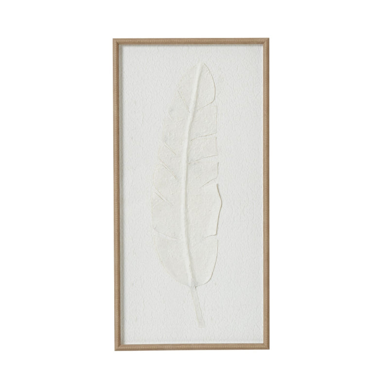 Framed artwork of a leaf on a white background