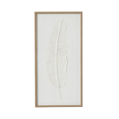 Framed artwork of a leaf on a white background