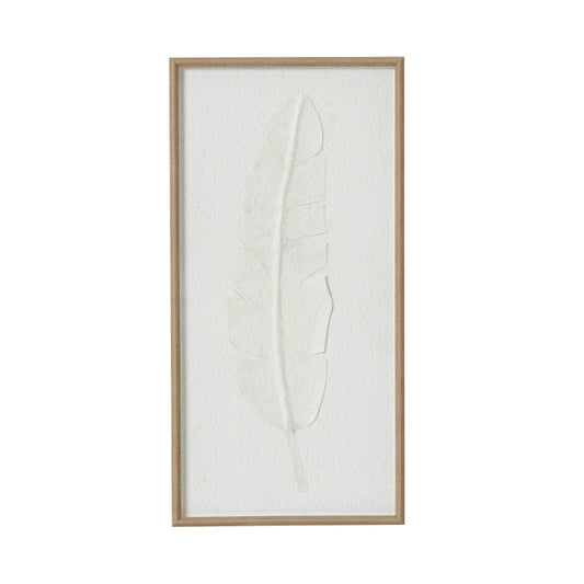 Framed artwork of a leaf on a white background