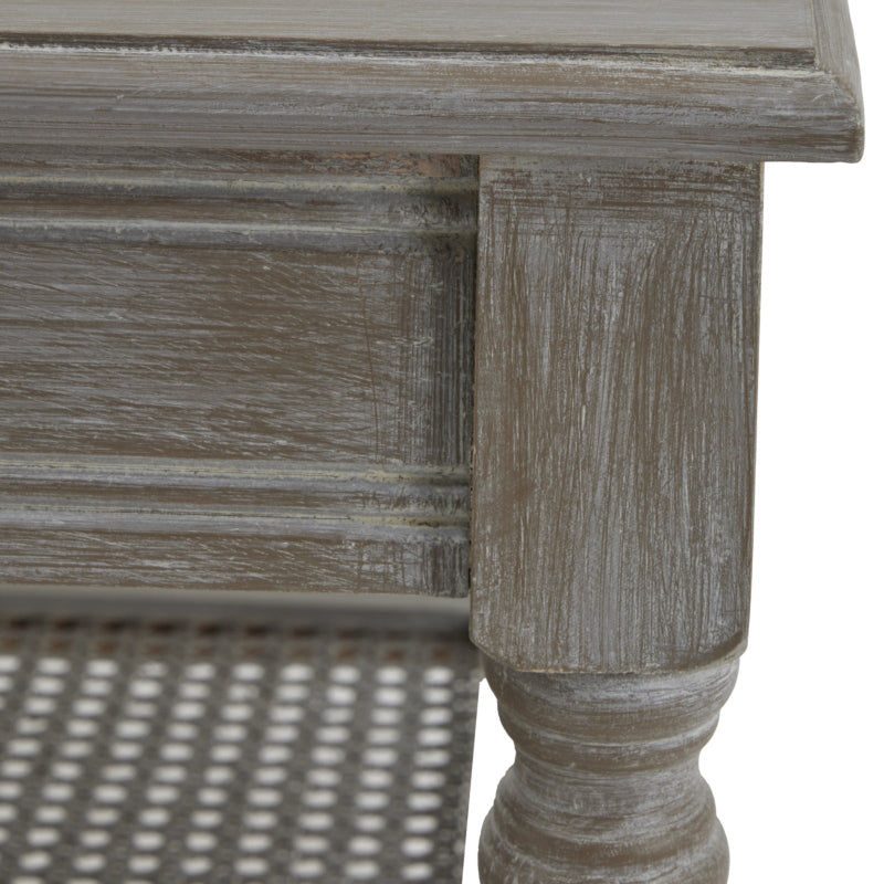 Wooden coffee table with a textured surface and turned leg on a white background
