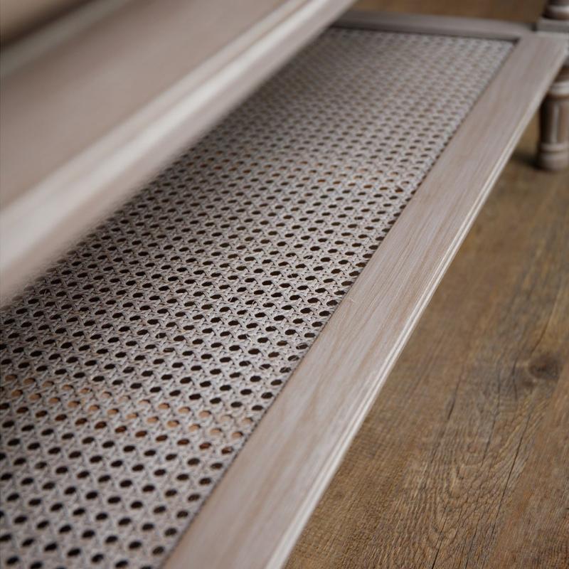 Perforated wooden strip on a wooden floor