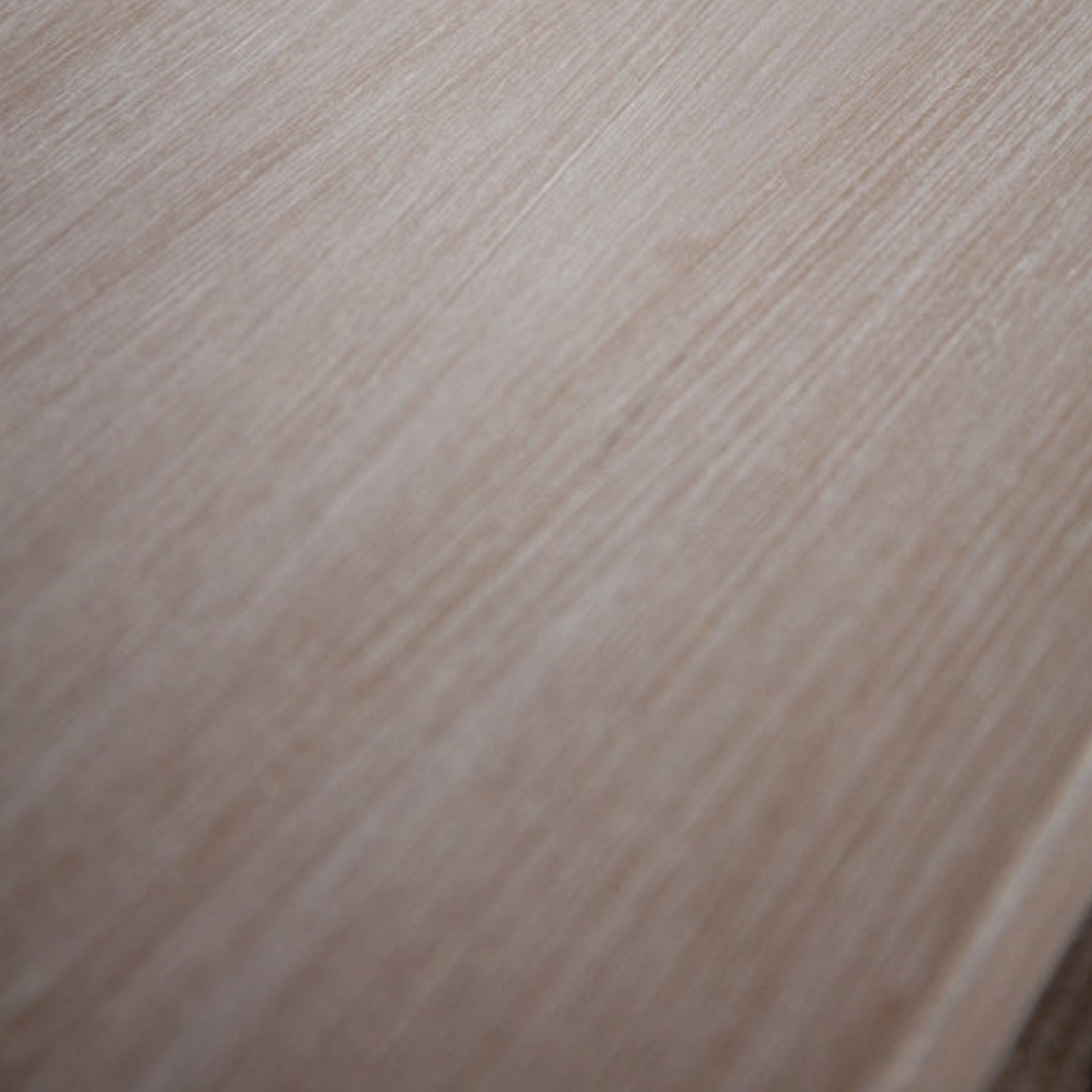 Close-up of a wooden surface with a light brown color.