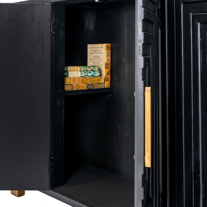 Black safe with open door revealing vintage books inside