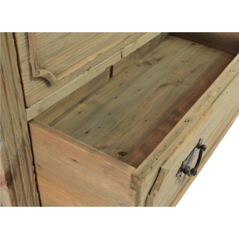 Close-up of a rustic wooden chest or cabinet drawer pulled open, showing the wood grain interior and a dark metal pull handle against a white background.