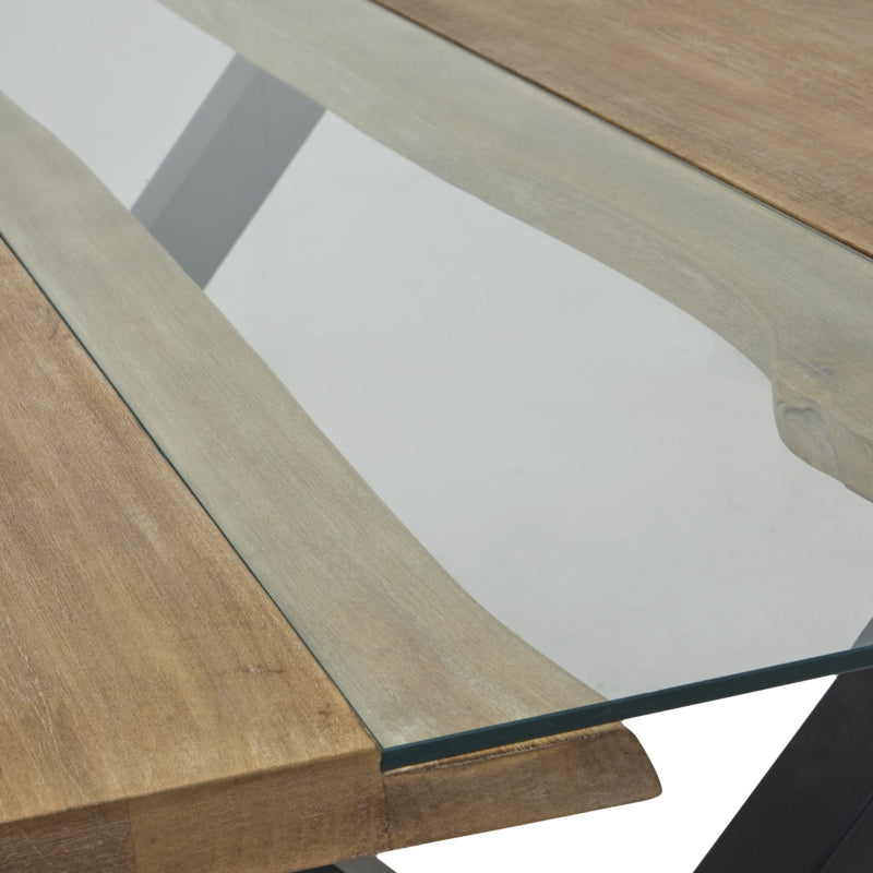 Close-up of a wooden table with a glass top